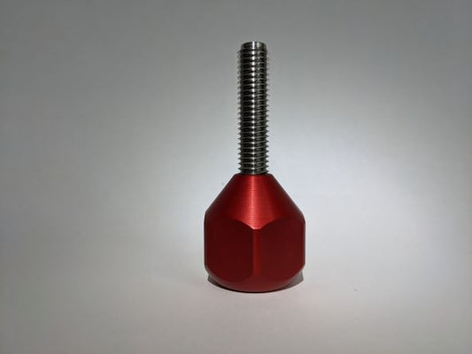 A Yak cheese stick accessory for the Treat Clincher. The Yak stick is made of stainless steel with a red handle.